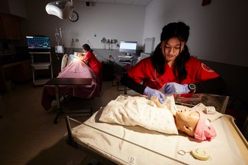 A nursing student at the bedside
